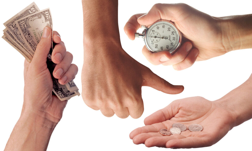 a close-up of hands holding a stopwatch and money