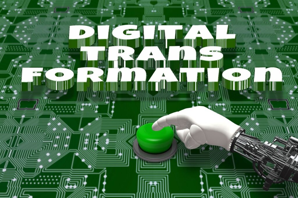 a hand pressing a green button under the headline 'Digital Transformation'